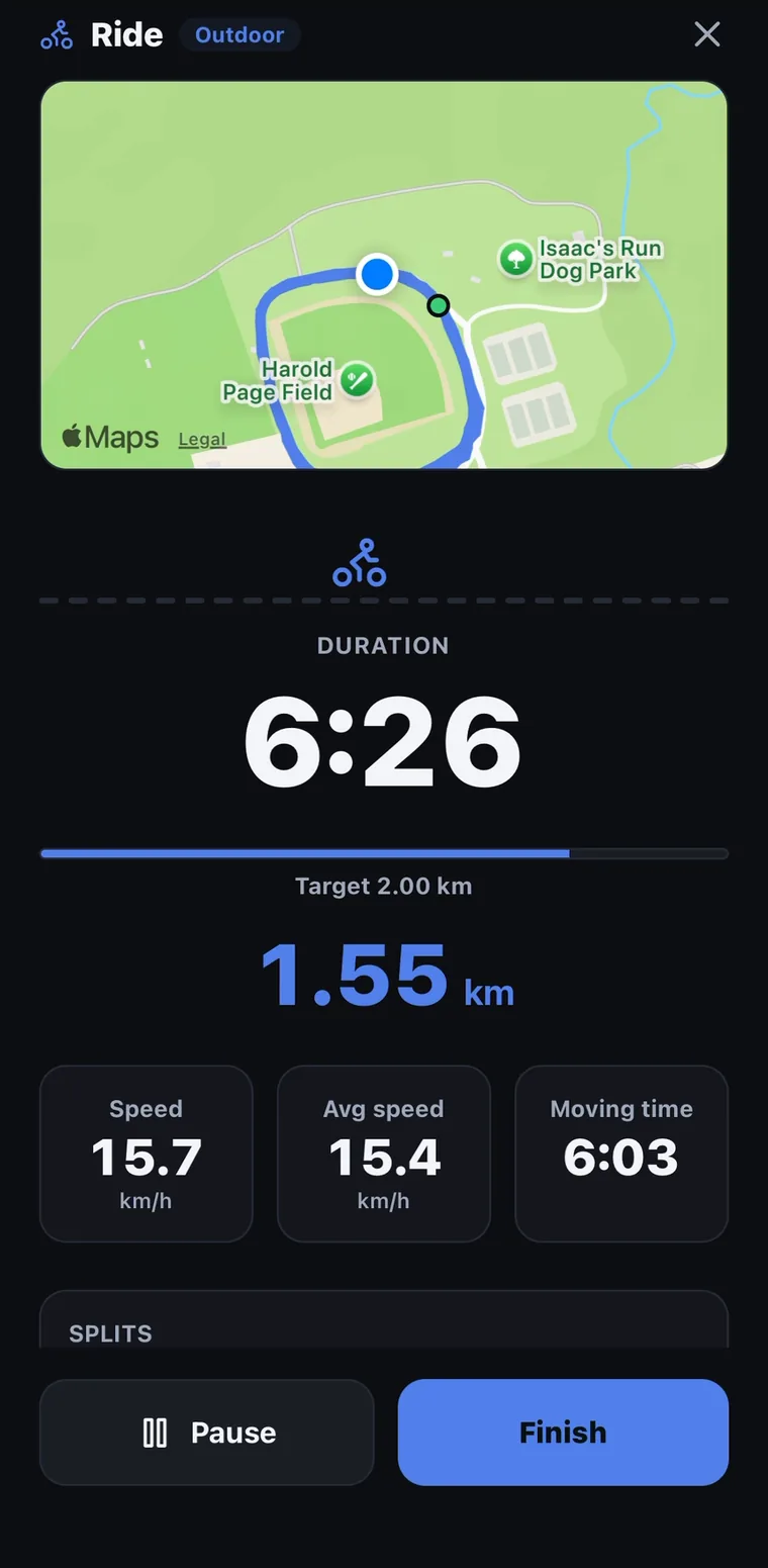 A live outdoor ride in FitTrack: the route on a map, duration, a bar filling towards the 2 km target, distance, speed, average speed and moving time.